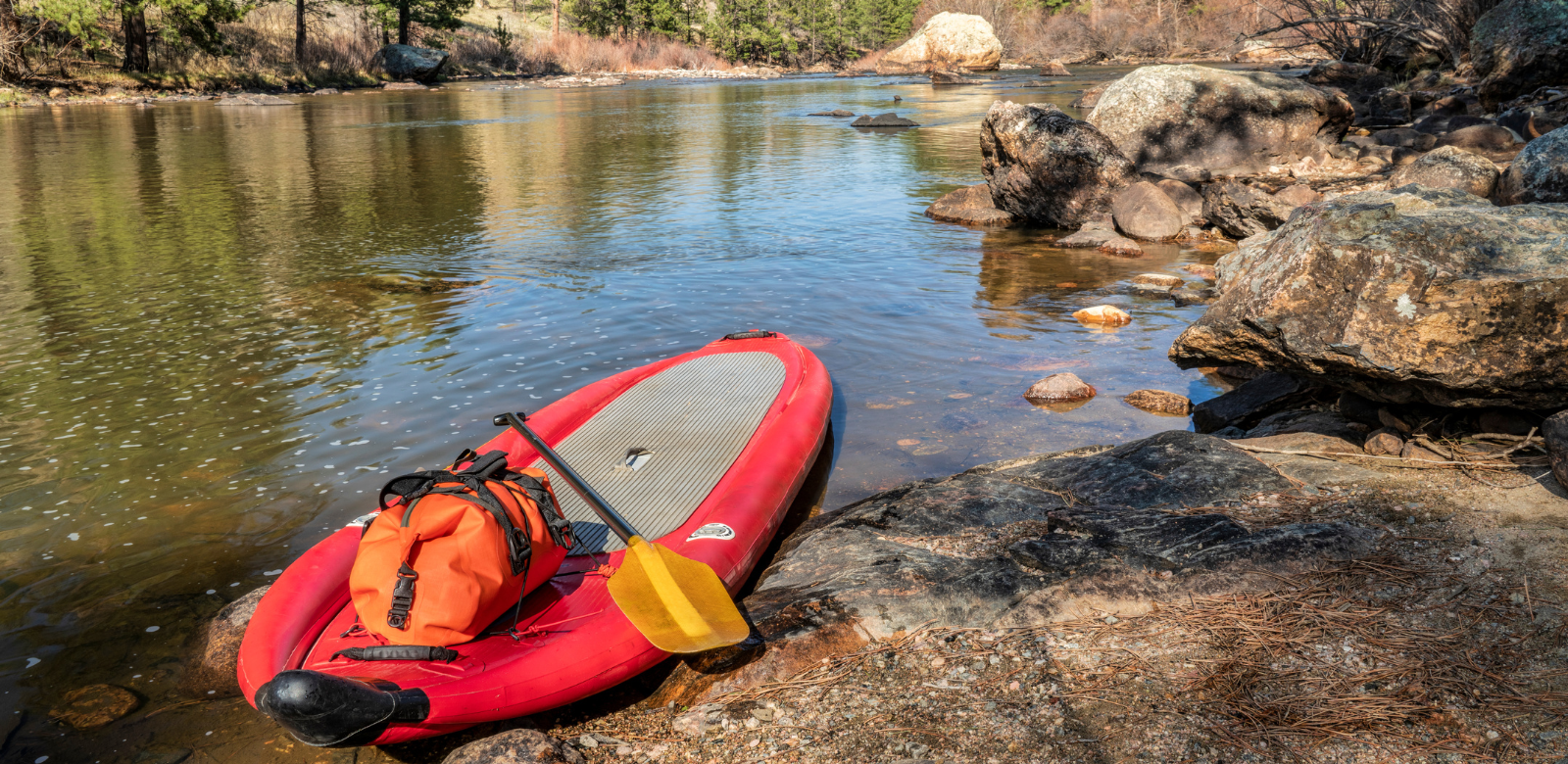 Paddle board in Pagosa Springs while overlooking the mountains