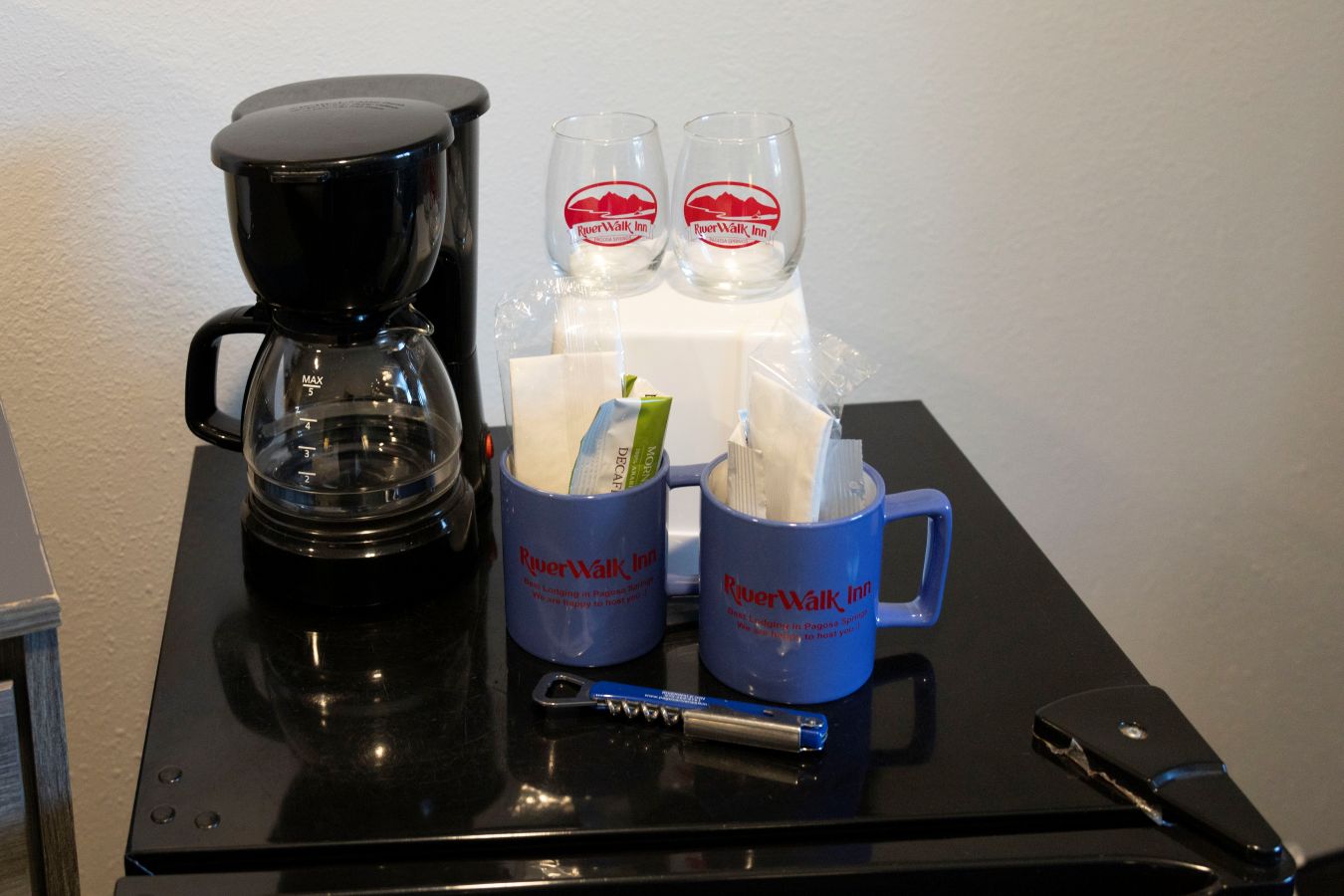 coffee maker, coffee cup, wine glasses
