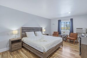Comfort King room with flat screen TV, fridge and coffee maker