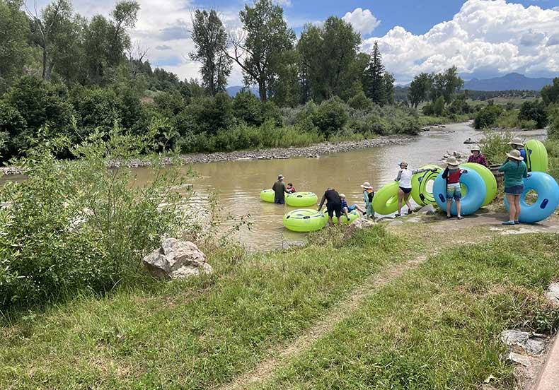 Groups enjoying the river tubing near the hotel