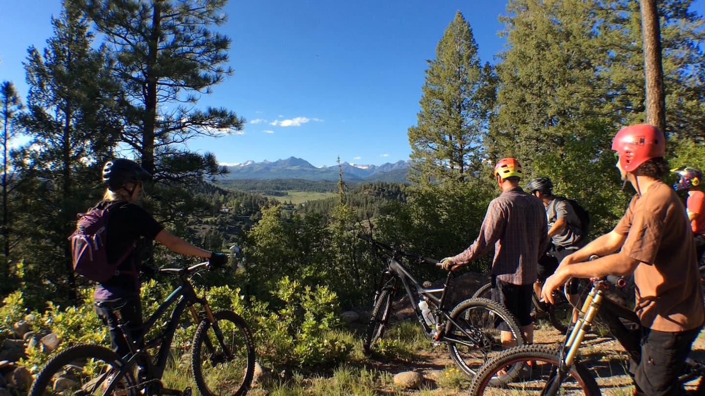 A group of friends biking in Reservoir Hill Park in Pagosa Springs, Co