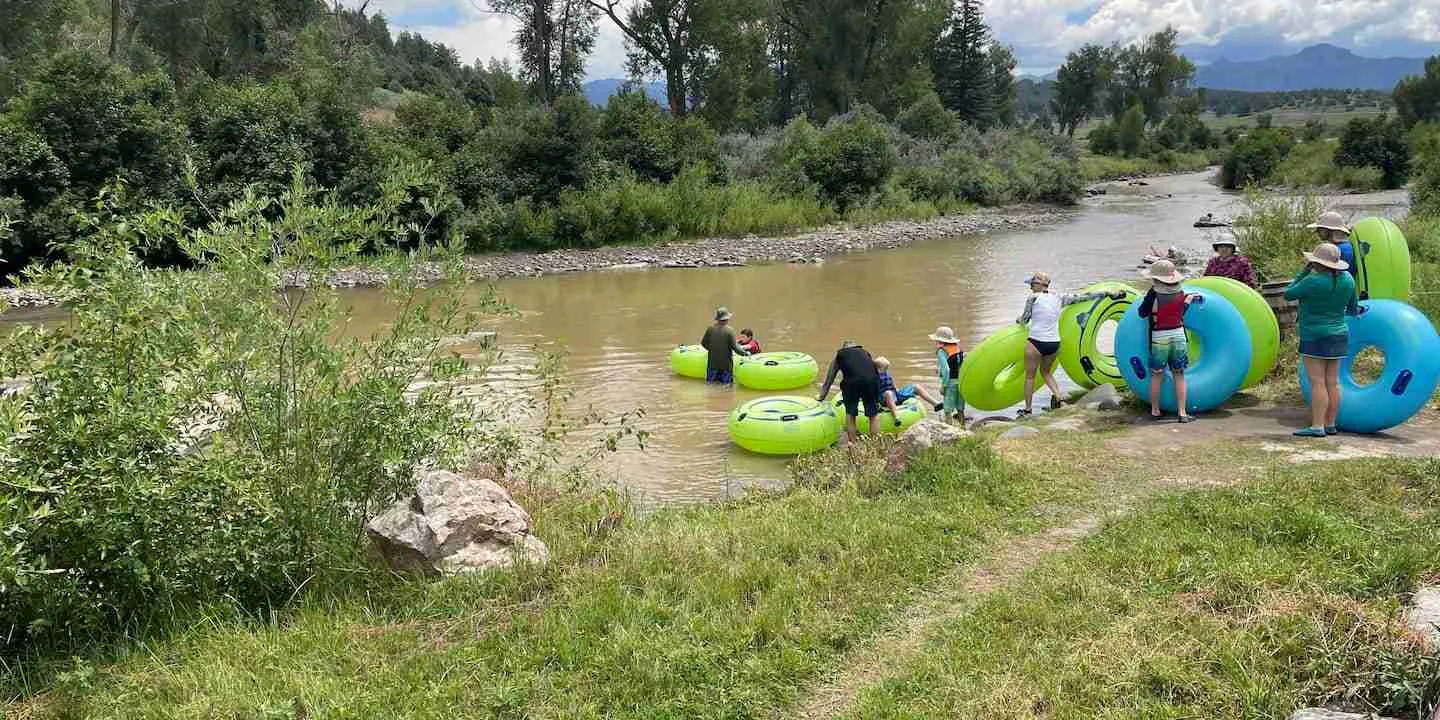 A family tubing on the San Juan River, one of many family-friendly things to do in Pagosa Springs