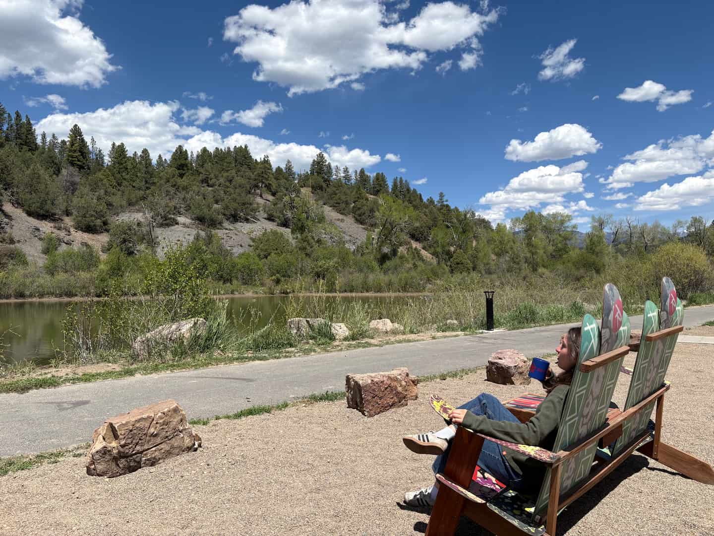 A guest enjoying time by the river outside of our Pagosa Springs hotel